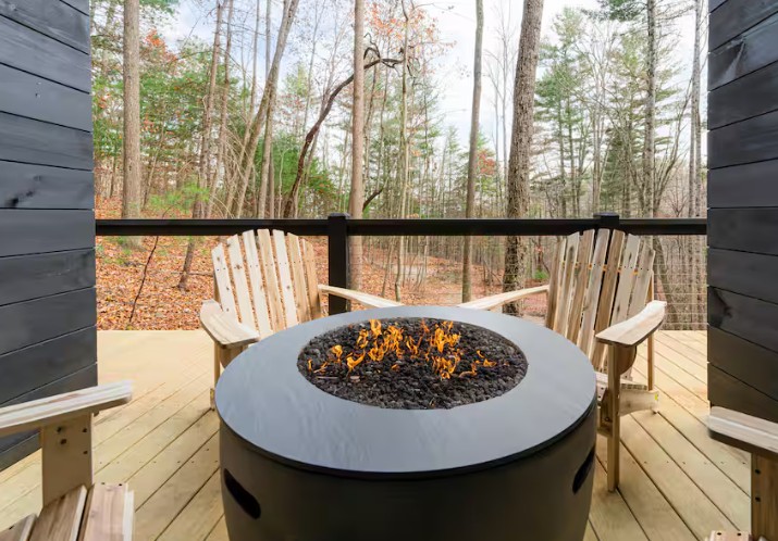 Fire pit with a view at Treehouse Scandi Log Cabin.