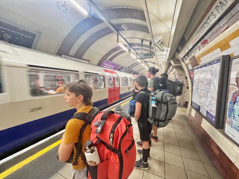 Family of backpackers on London underground