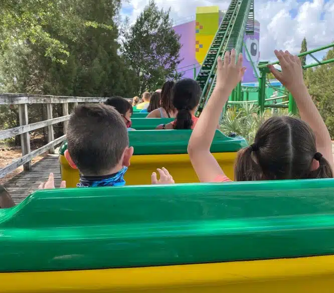 Kids in a roller coaster at Legoland