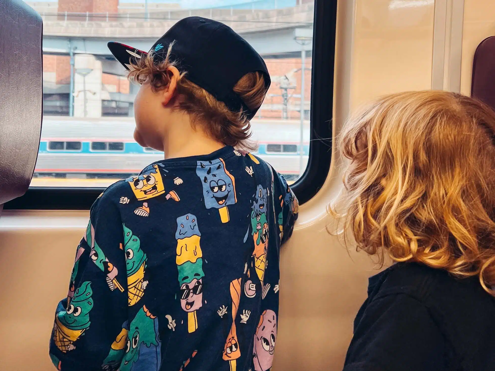 Ottis and Arlo on the train in Boston