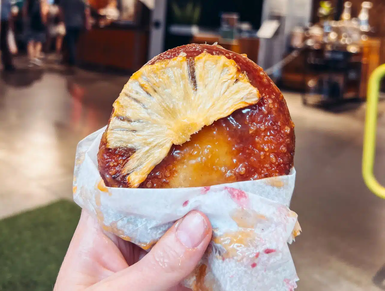 Holding a delicious donut at Union Square Donuts