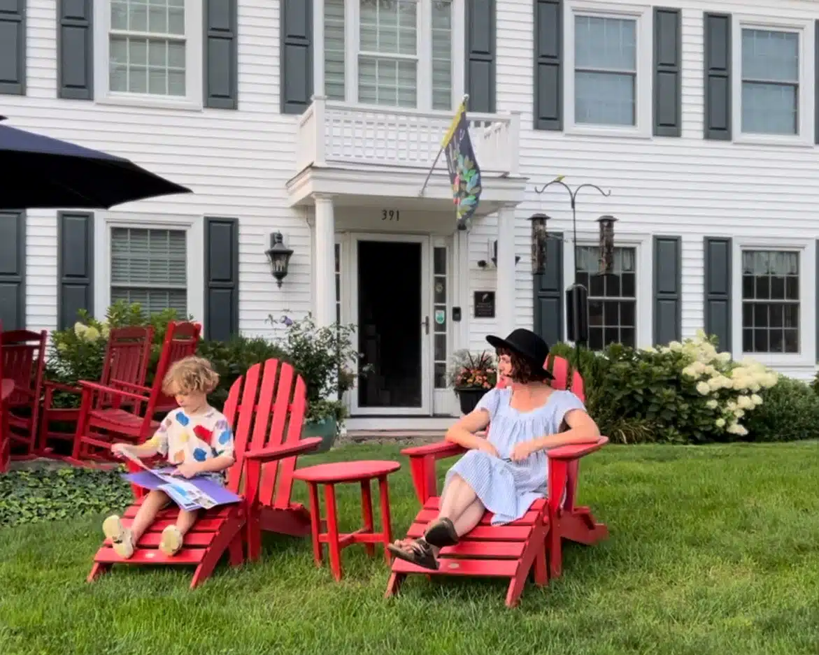 Victoria and her son sat on red sunbeds at Homestead Madison.