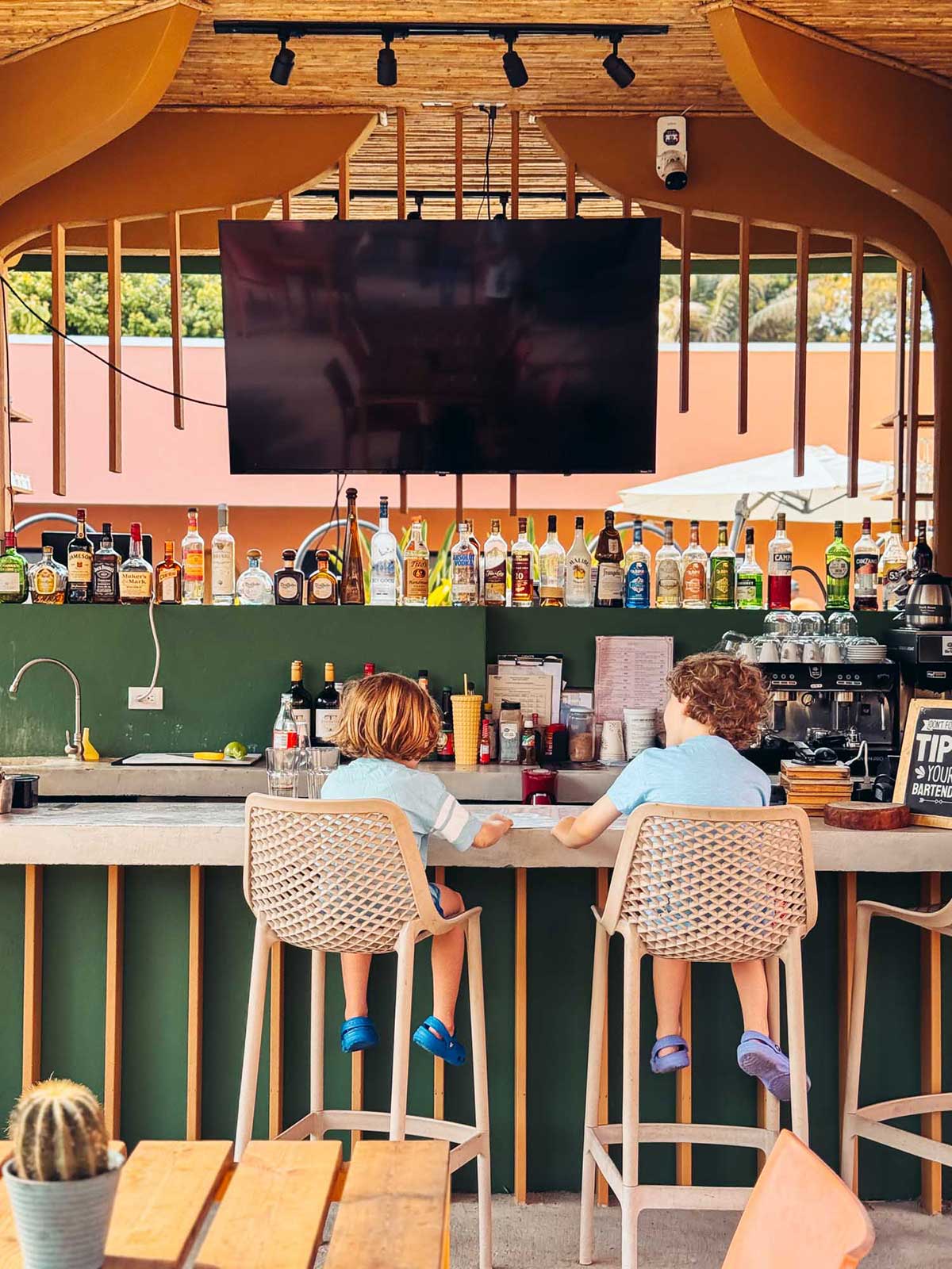 Kids at the bar inside Amavi Hotel in Jaco, Costa Rica.
