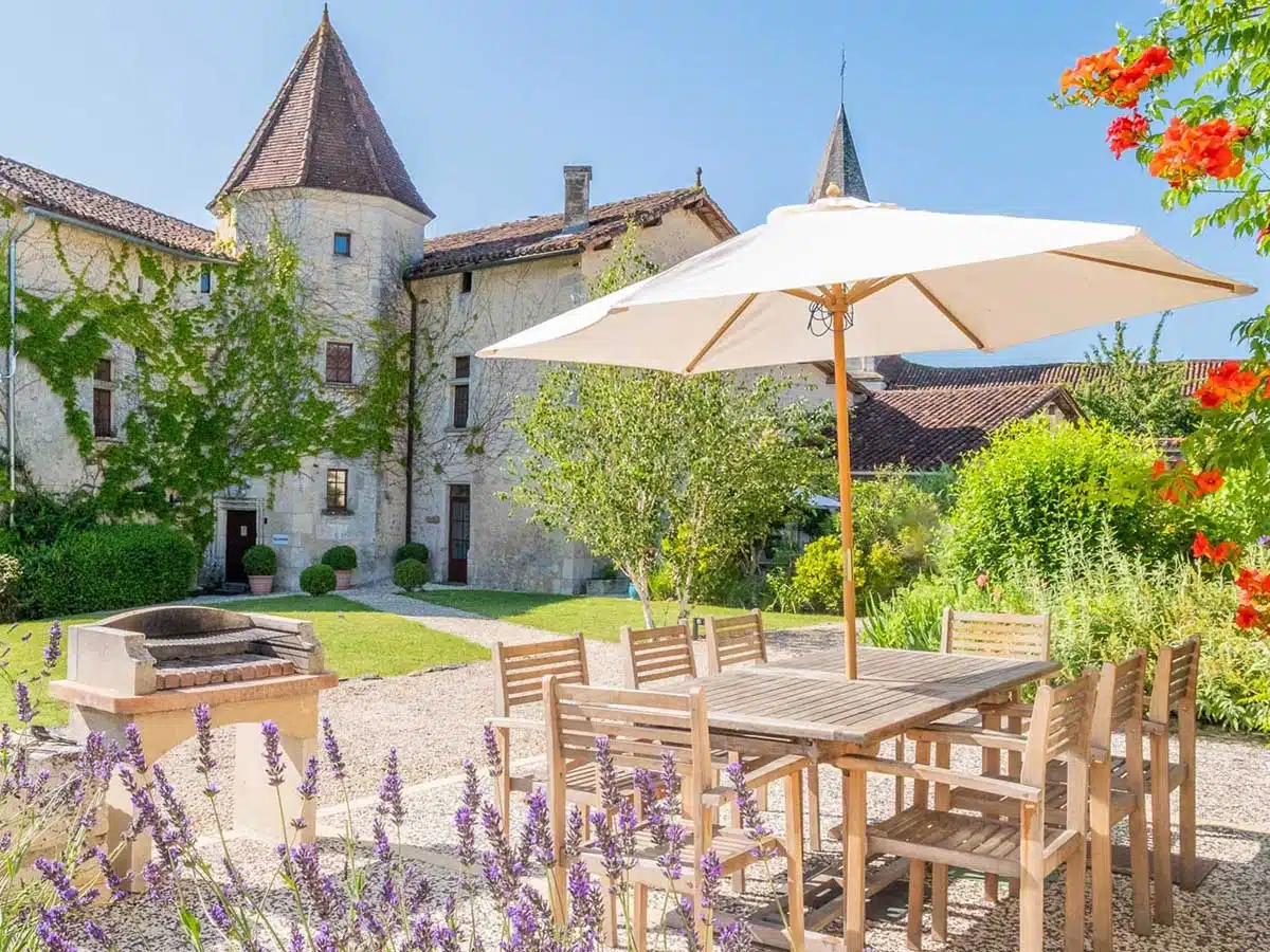 Outdoor seating and gardens at Chateau Gurat.