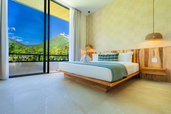 Bedroom with king bed with a view at luxury volcano villa in San Carlos, Costa Rica.