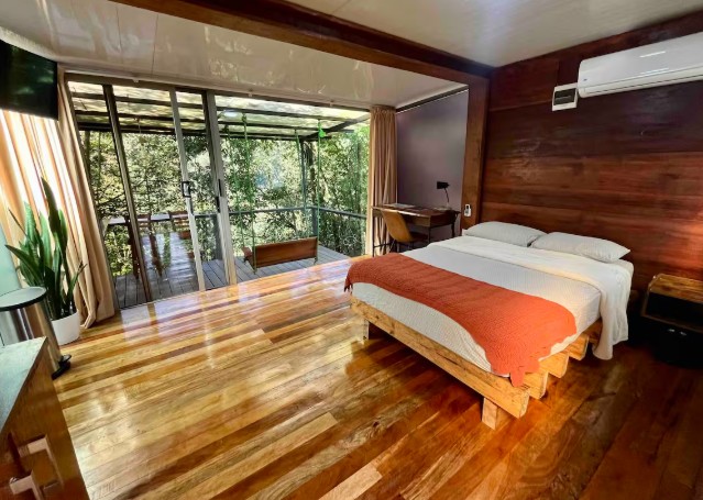 Bedroom at a private room in nature lodge in Quesada, Costa Rica.